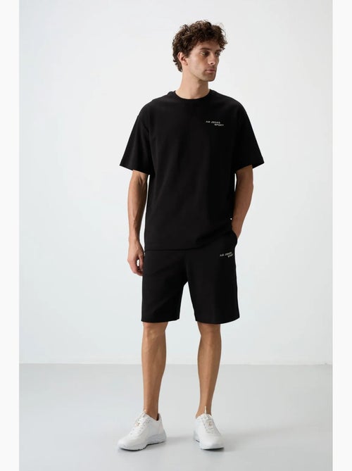 Conjunto de t-shirt oversized de manga curta e calções tommy - Kiabi Conjunto de t-shirt oversized de manga curta e calções tommy - Kiabi