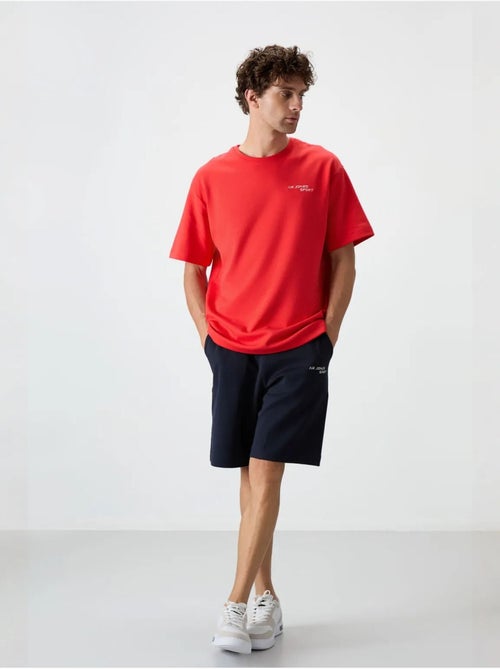 Conjunto de t-shirt oversized de manga curta e calções tommy - Kiabi Conjunto de t-shirt oversized de manga curta e calções tommy - Kiabi