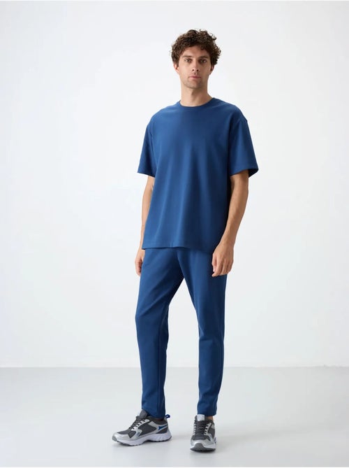Conjunto de t-shirt oversized e calças de homem tommy - Kiabi Conjunto de t-shirt oversized e calças de homem tommy - Kiabi