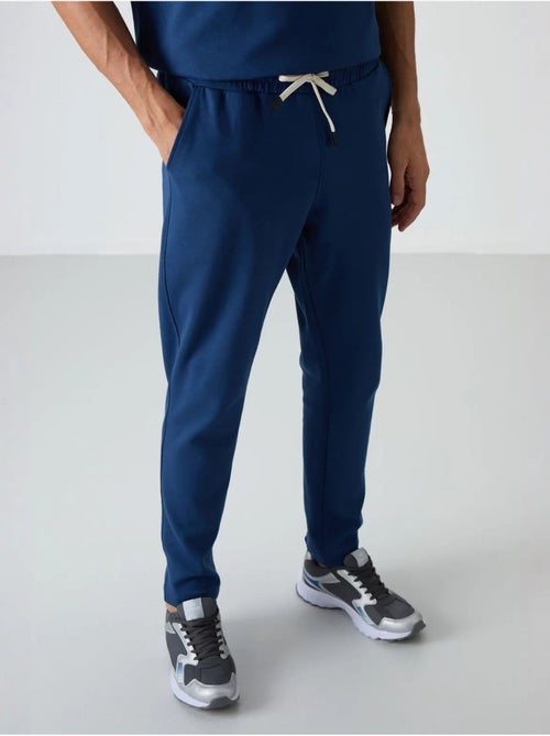Conjunto de t-shirt oversized e calças de homem tommy - Kiabi Conjunto de t-shirt oversized e calças de homem tommy - Kiabi