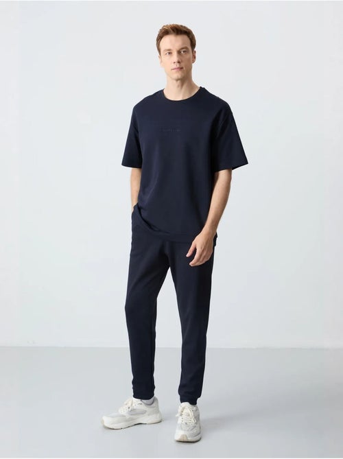 Conjunto de t-shirt oversized e calças de homem tommy - Kiabi Conjunto de t-shirt oversized e calças de homem tommy - Kiabi