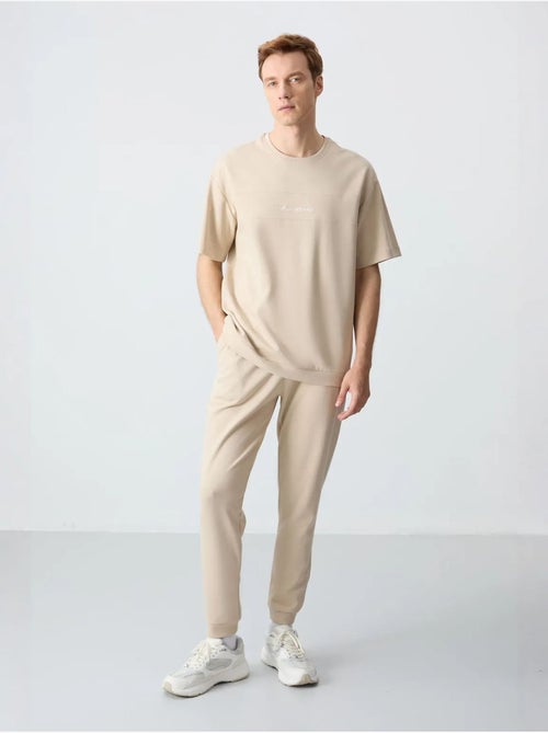 Conjunto de t-shirt oversized e calças de homem tommy - Kiabi Conjunto de t-shirt oversized e calças de homem tommy - Kiabi