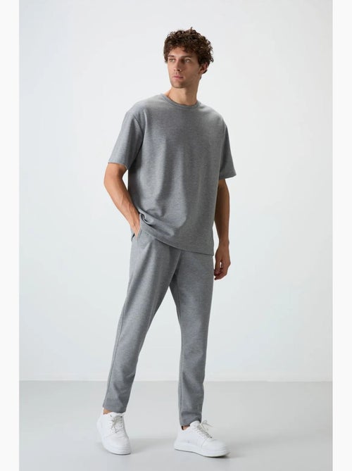 Conjunto de t-shirt oversized e calças de homem tommy - Kiabi Conjunto de t-shirt oversized e calças de homem tommy - Kiabi