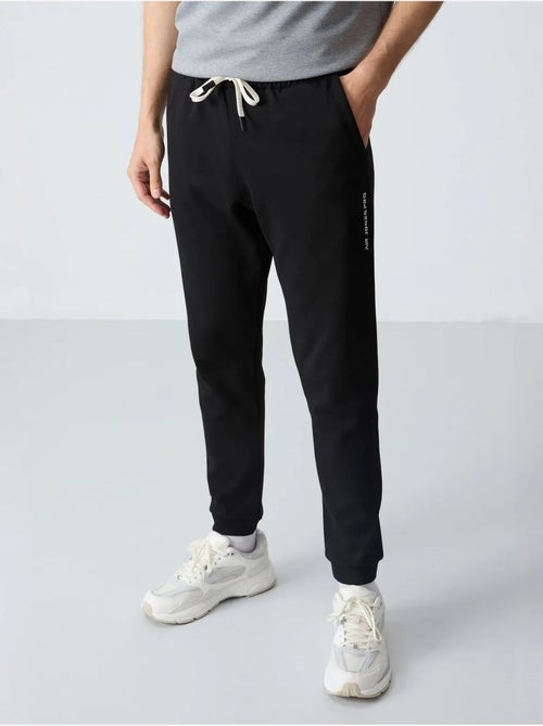 Conjunto de t-shirt oversized e calças de homem tommy - Kiabi Conjunto de t-shirt oversized e calças de homem tommy - Kiabi