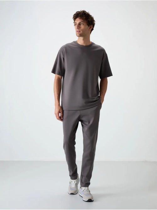 Conjunto de t-shirt oversized e calças de homem tommy - Kiabi Conjunto de t-shirt oversized e calças de homem tommy - Kiabi