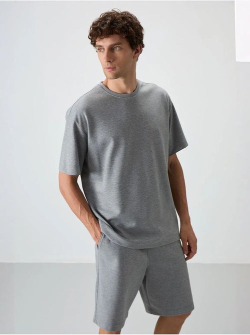 Conjunto de t-shirt oversized e calções tommy - Kiabi Conjunto de t-shirt oversized e calções tommy - Kiabi