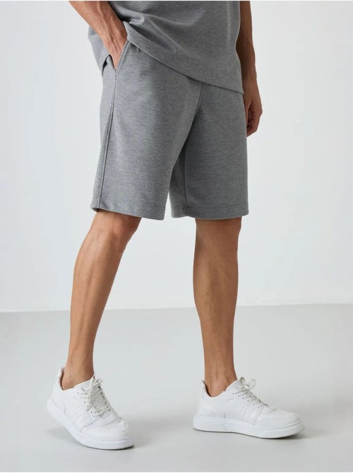 Conjunto de t-shirt oversized e calções tommy - Kiabi Conjunto de t-shirt oversized e calções tommy - Kiabi