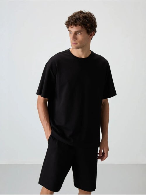Conjunto de t-shirt oversized e calções tommy - Kiabi Conjunto de t-shirt oversized e calções tommy - Kiabi