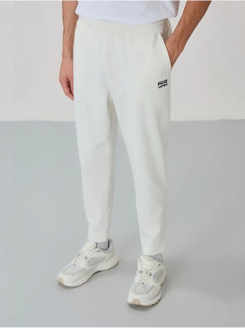 Conjunto masculino de sweatshirt com gola com fecho e calças tommy - Kiabi Conjunto masculino de sweatshirt com gola com fecho e calças tommy - Kiabi