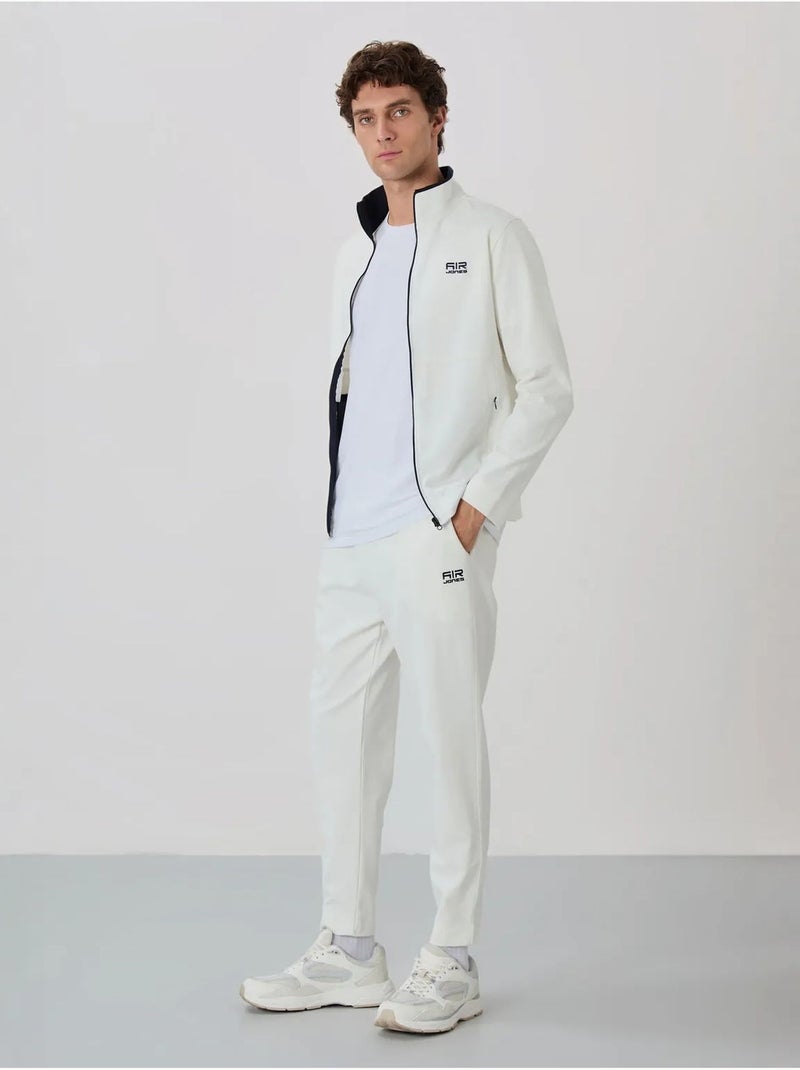 Conjunto masculino de sweatshirt com gola com fecho e calças tommy Branco sujo - Kiabi
