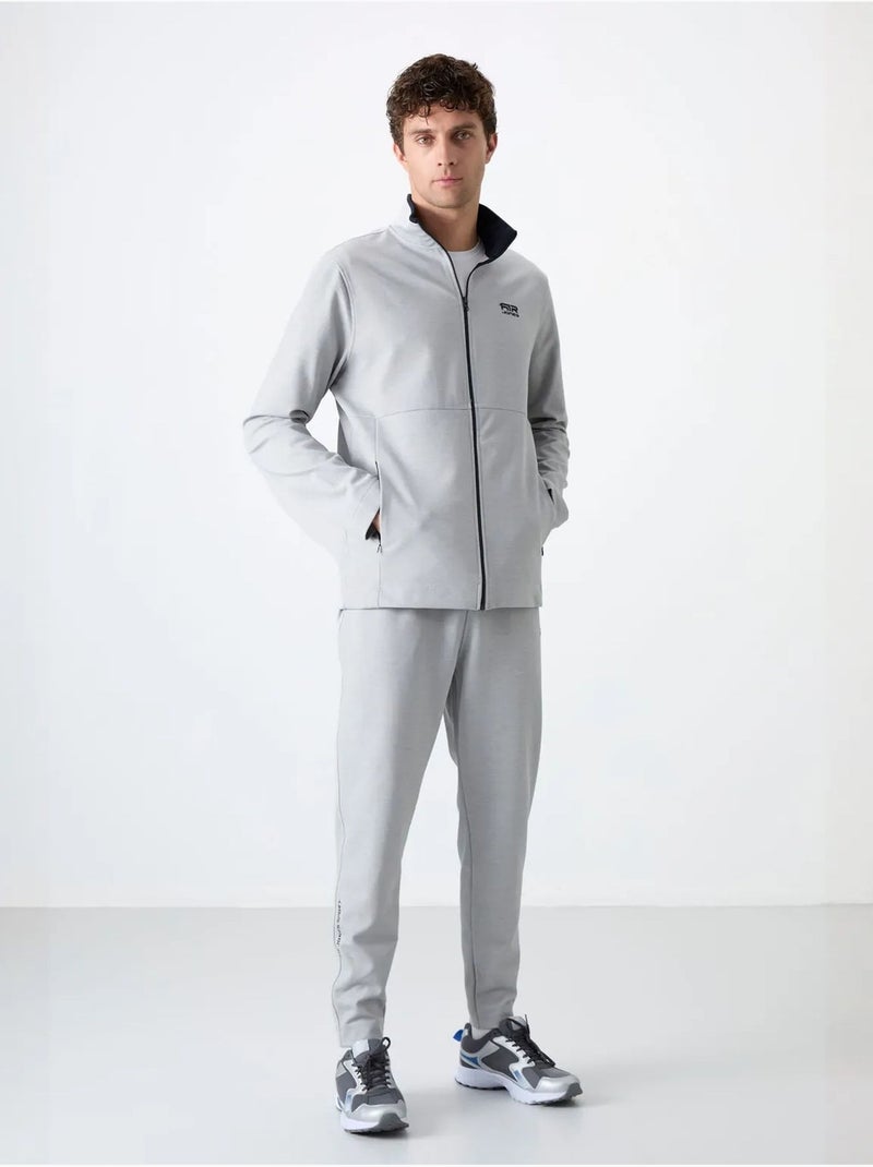 Conjunto masculino de sweatshirt com gola com fecho e calças tommy Cinza claro - Kiabi