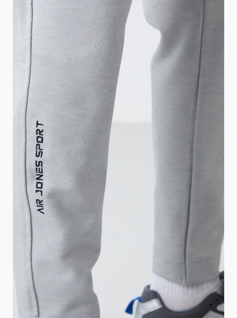 Conjunto masculino de sweatshirt com gola com fecho e calças tommy Cinza claro - Kiabi