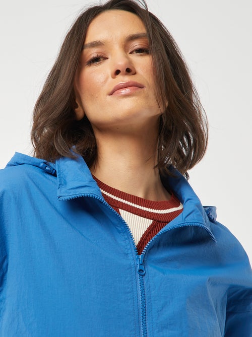 Corta-vento com capuz - Kiabi