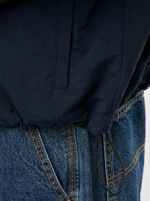 Corta-vento com capuz e mangas removíveis - Kiabi