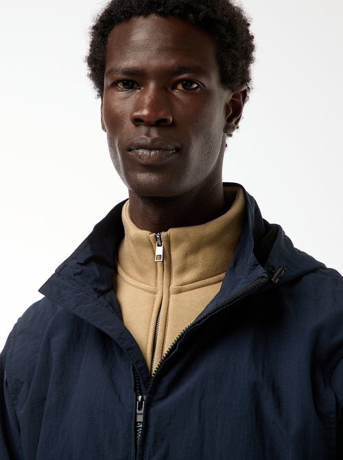 Corta-vento com capuz e mangas removíveis - Kiabi