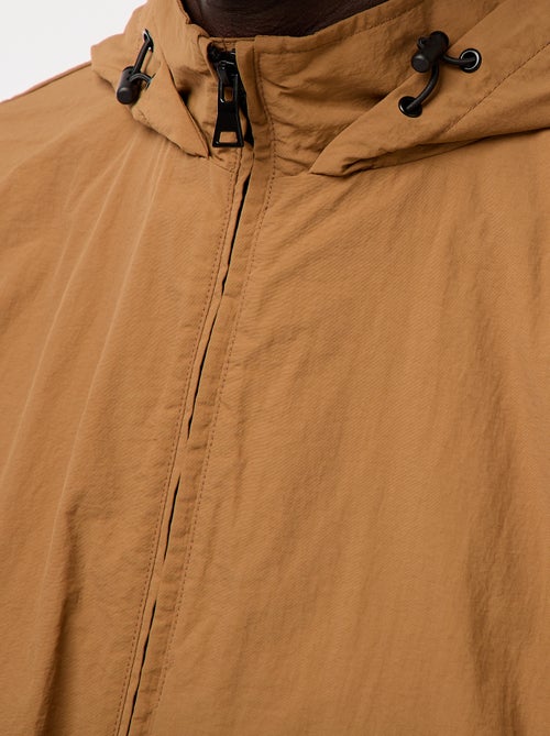 Corta-vento com capuz e mangas removíveis - Kiabi