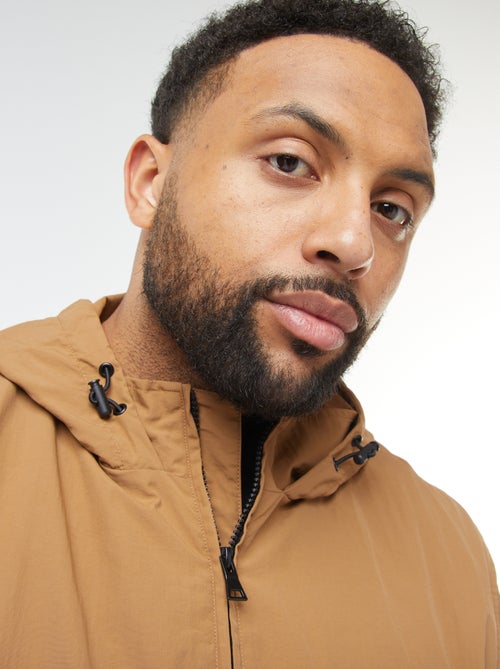 Corta-vento impermeável com capuz com mangas amovíveis - Kiabi