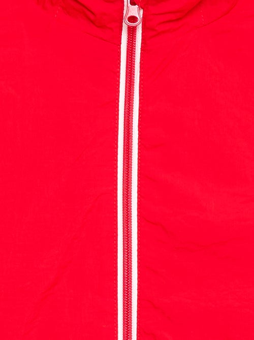 Corta-vento liso dobrável no capuz - Kiabi