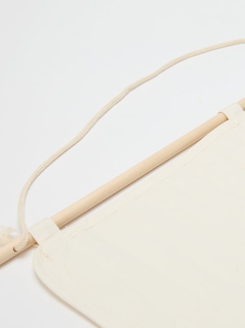 Decoração mural com bolsas de arrumação - Kiabi