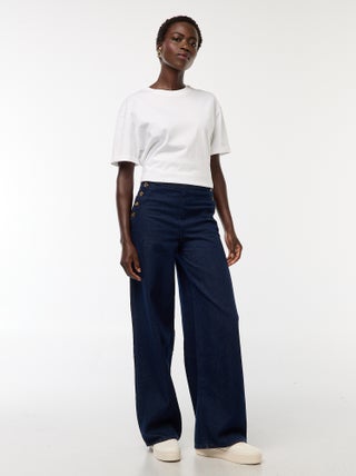 Jeans de corte largo com botões nas laterais