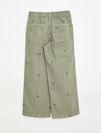 Jeans de perna larga com padrão bordado