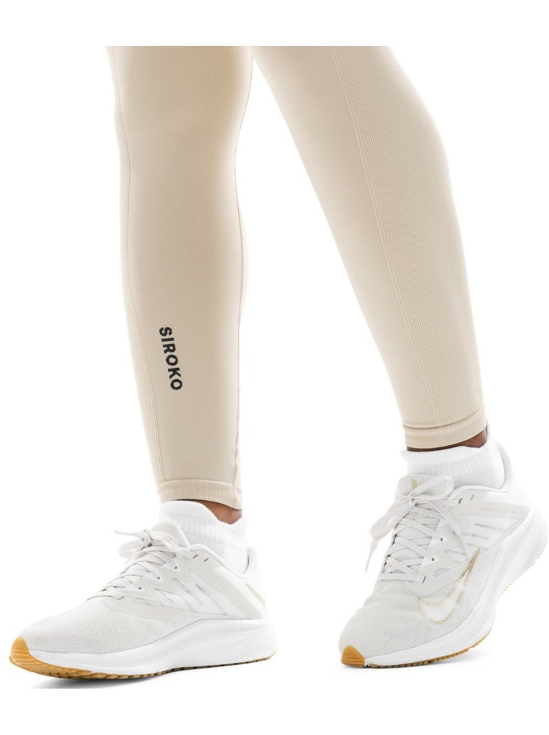 Leggings de treino sem costuras para mulher Bege - Kiabi