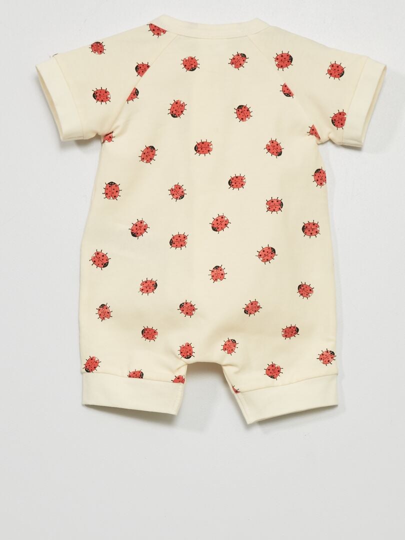 Macacão curto estampado 'DIM' BEGE - Kiabi
