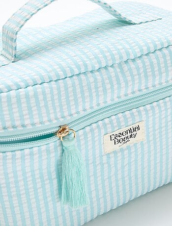 Necessaire com padrão e pega de transporte