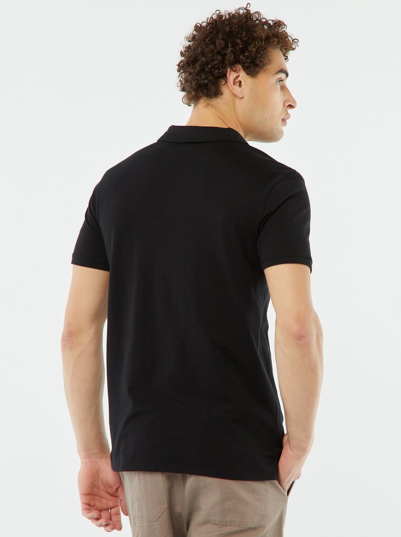 Polo de manga curta liso em jersey Preto - Kiabi