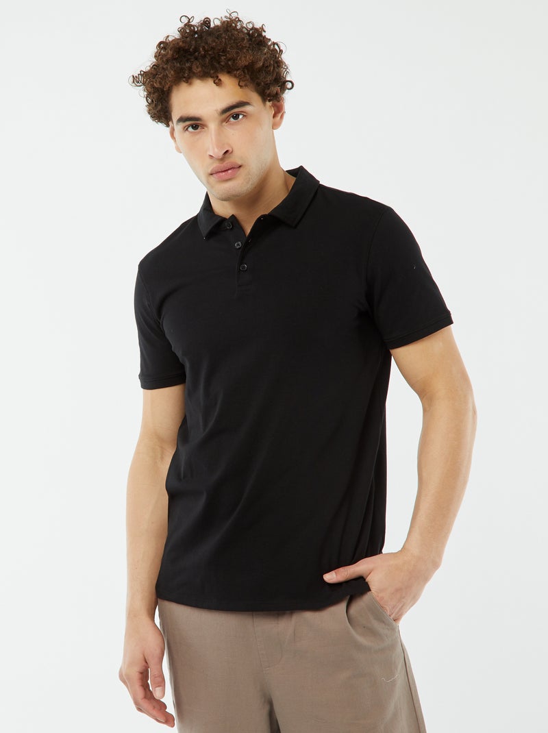 Polo de manga curta liso em jersey Preto - Kiabi