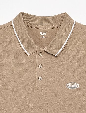 Polo em piqué de algodão com bordado frontal