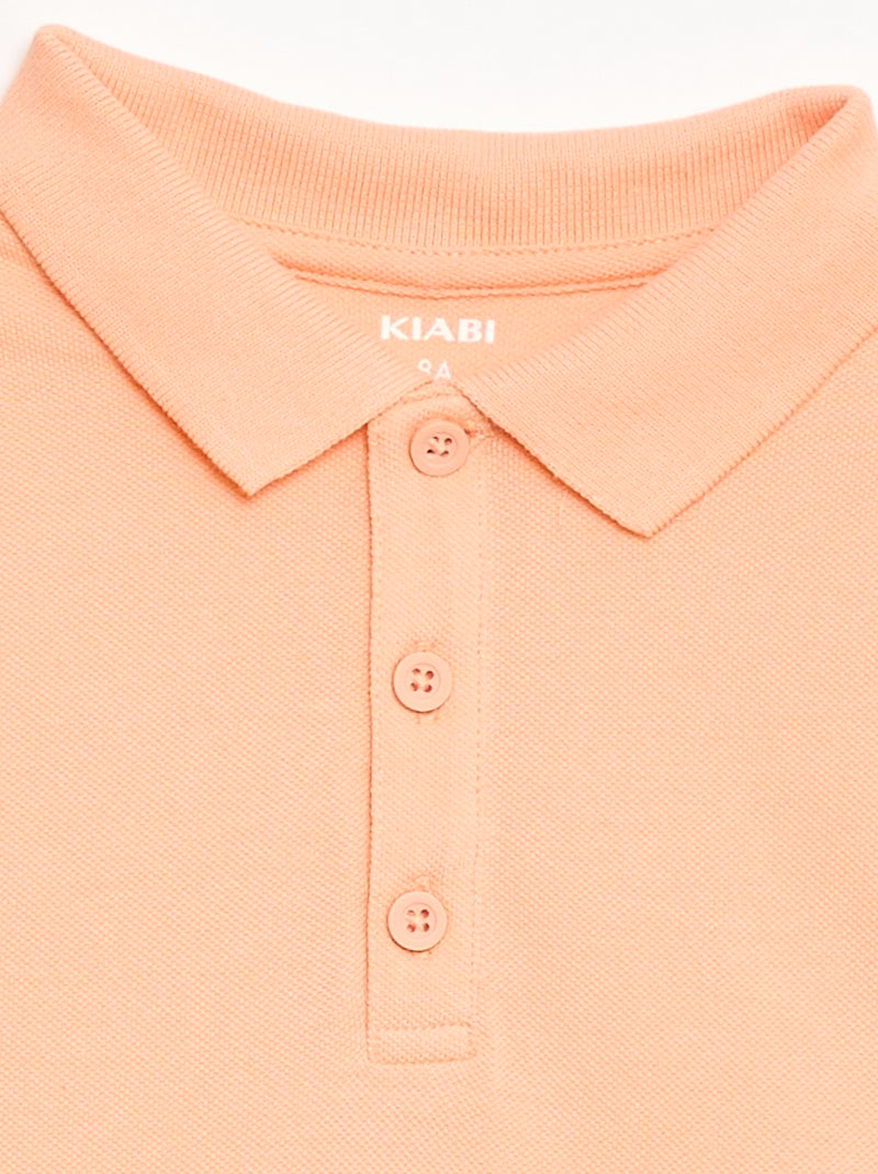 Polo liso em malha piqué Pêssego - Kiabi