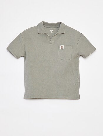 Polo loose com bolso