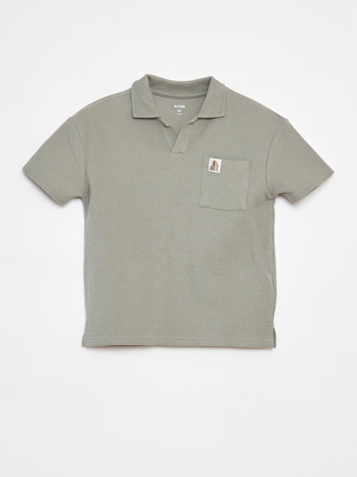Polo loose com bolso - Kiabi