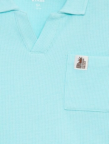 Polo loose com bolso