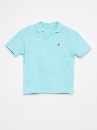 Polo loose com bolso