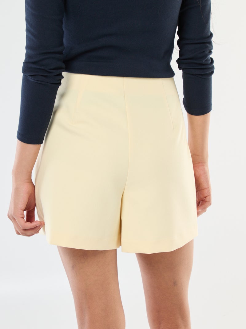 Saia-calção assimétrica com botão dourado Amarelo - Kiabi