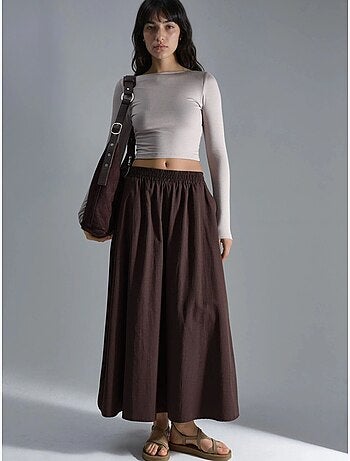 Saia maxi com cintura elástica e bolsos busem