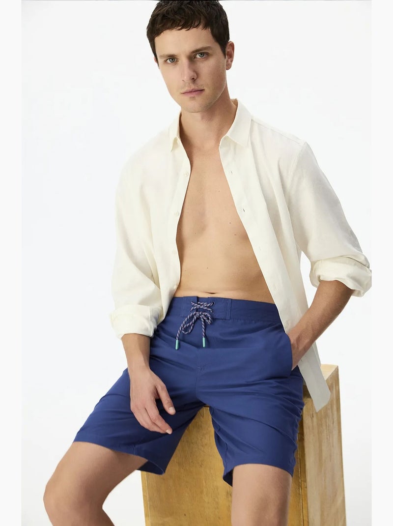 Short masculino surfer com estampa de slogan penti Azul-marinho - Kiabi