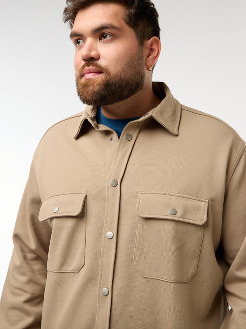 Sobrecamisa em material piqué com abertura de botões de pressão - Kiabi