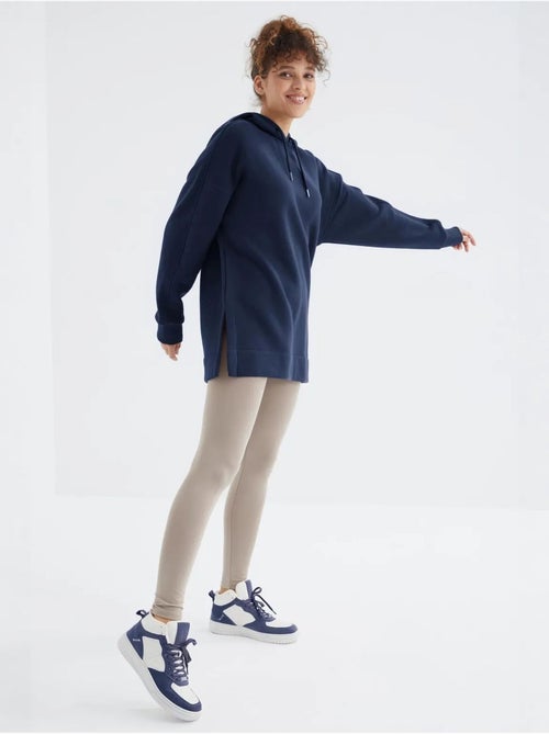 Suéter oversized com bolso tommy - Kiabi Suéter oversized com bolso tommy - Kiabi