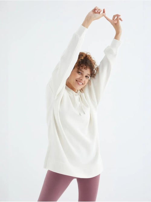 Suéter oversized com bolso tommy - Kiabi Suéter oversized com bolso tommy - Kiabi
