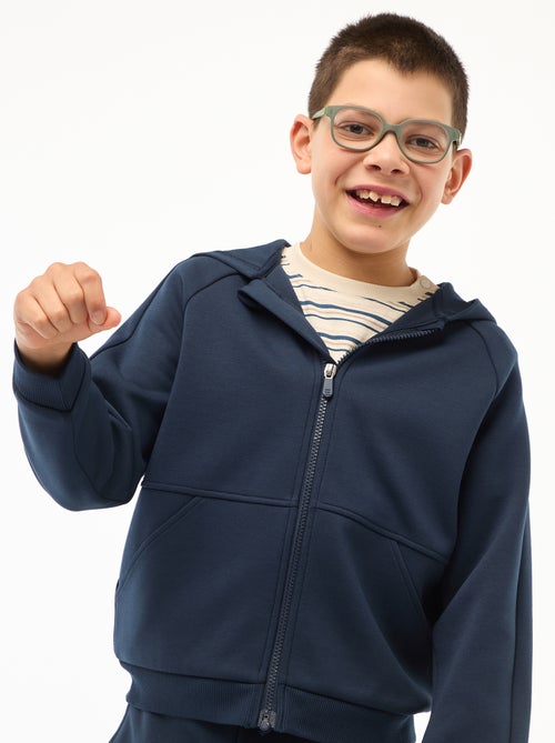 Sweat com fecho e capuz - coleção fácil de vestir - Kiabi Sweat com fecho e capuz - coleção fácil de vestir - Kiabi