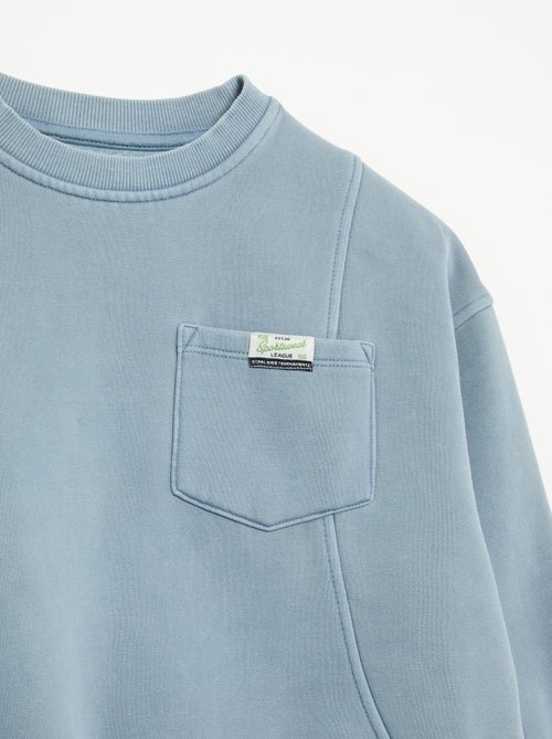 Sweat largo com recortes e bolso no peito - Kiabi Sweat largo com recortes e bolso no peito - Kiabi