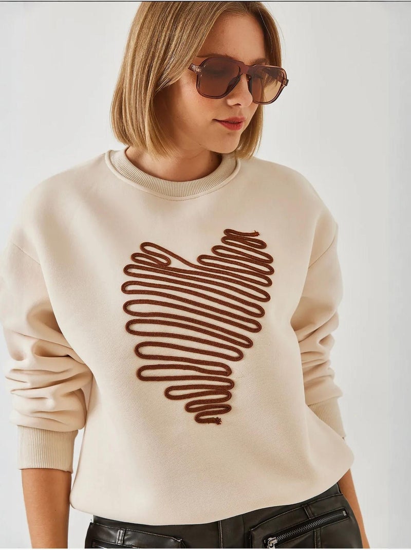 Sweatshirt bordada com coração lucci Creme - Kiabi