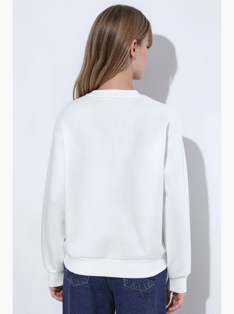 Sweatshirt com bordado de coração e gola redonda hiccup Creme - Kiabi