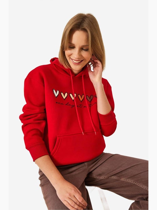 Sweatshirt com capuz e estampado de coração escovado de três fios lucci - Kiabi Sweatshirt com capuz e estampado de coração escovado de três fios lucci - Kiabi