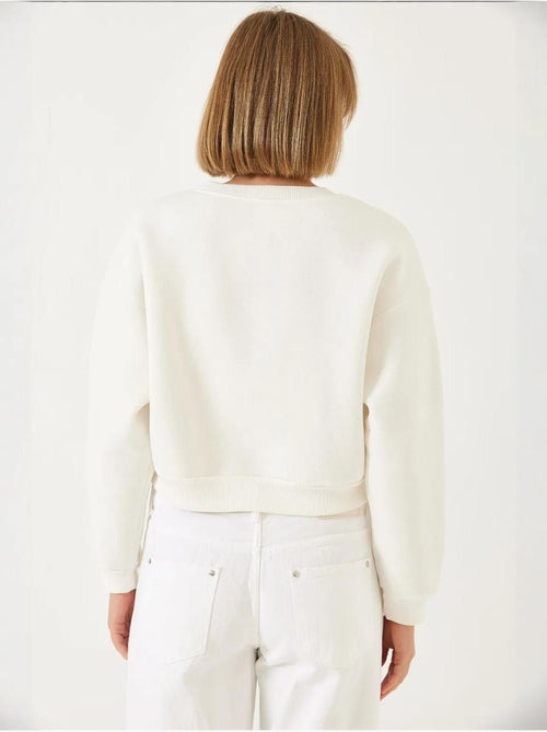 Sweatshirt com gola redonda e bordado de pérolas, fio triplo escovado lucci - Kiabi Sweatshirt com gola redonda e bordado de pérolas, fio triplo escovado lucci - Kiabi