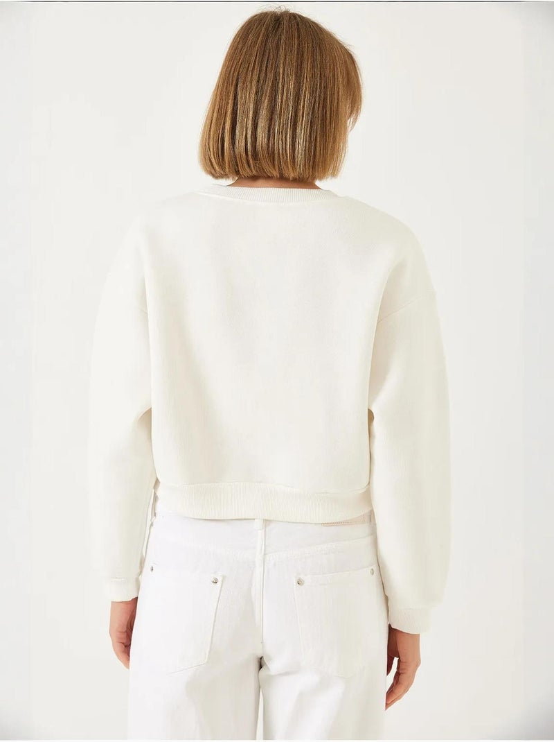 Sweatshirt com gola redonda e bordado de pérolas, fio triplo escovado lucci Creme - Kiabi