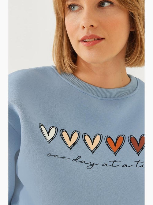 Sweatshirt de gola redonda com estampado de corações lucci - Kiabi
